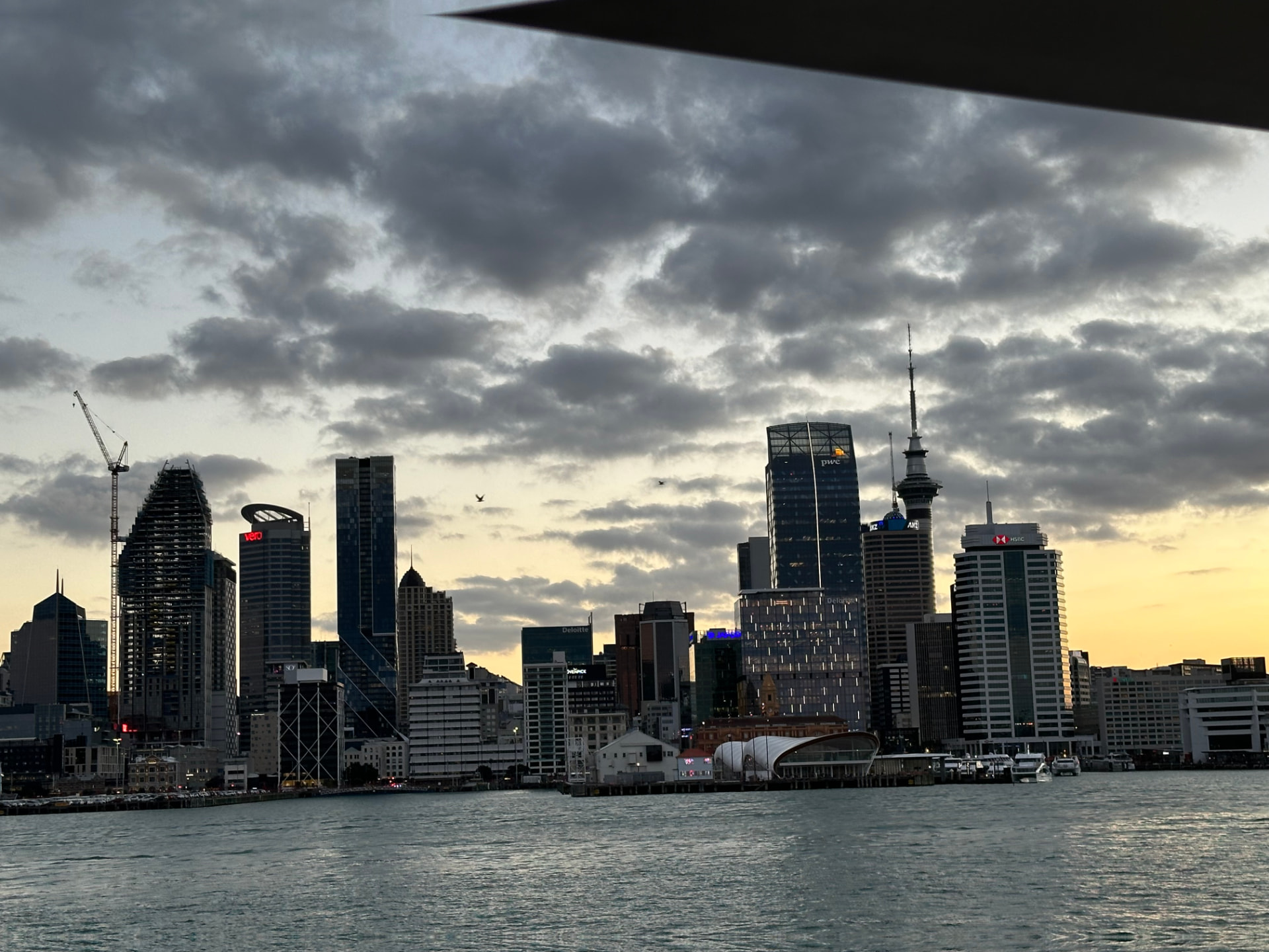 Auckland skyline at sunset seen from the harbour ferry