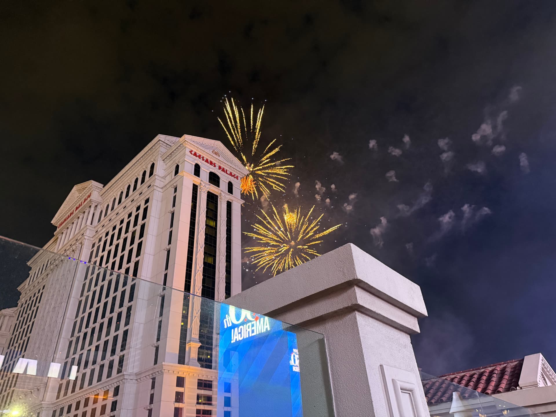 Fireworks bursting over Caesars Palace in Las Vegas at night