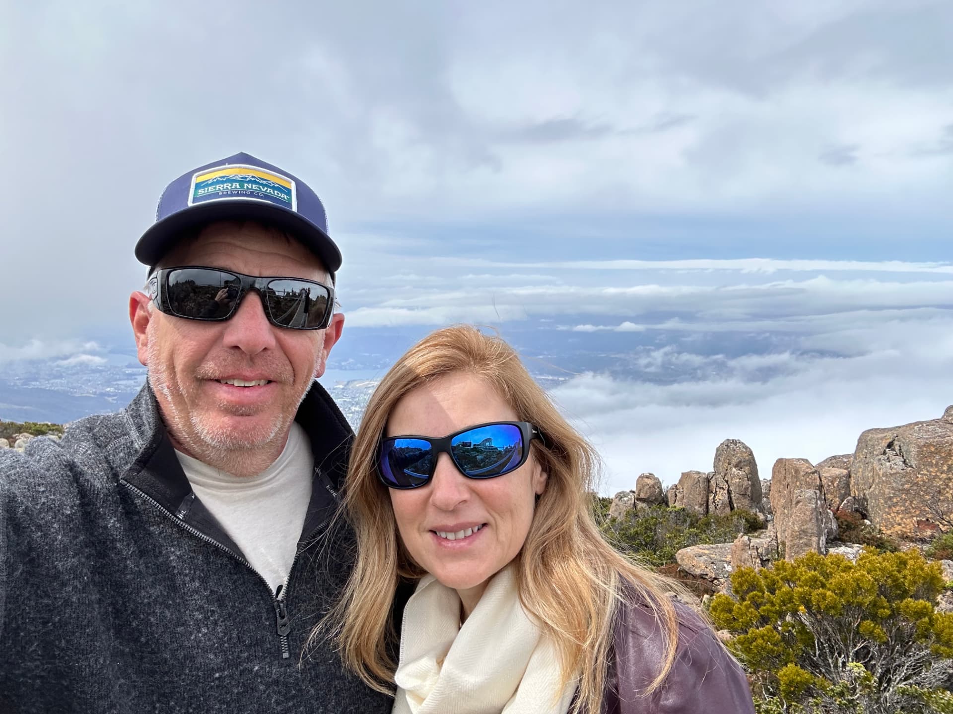Natalia and her husband at the Mount Wellington summit above the clouds