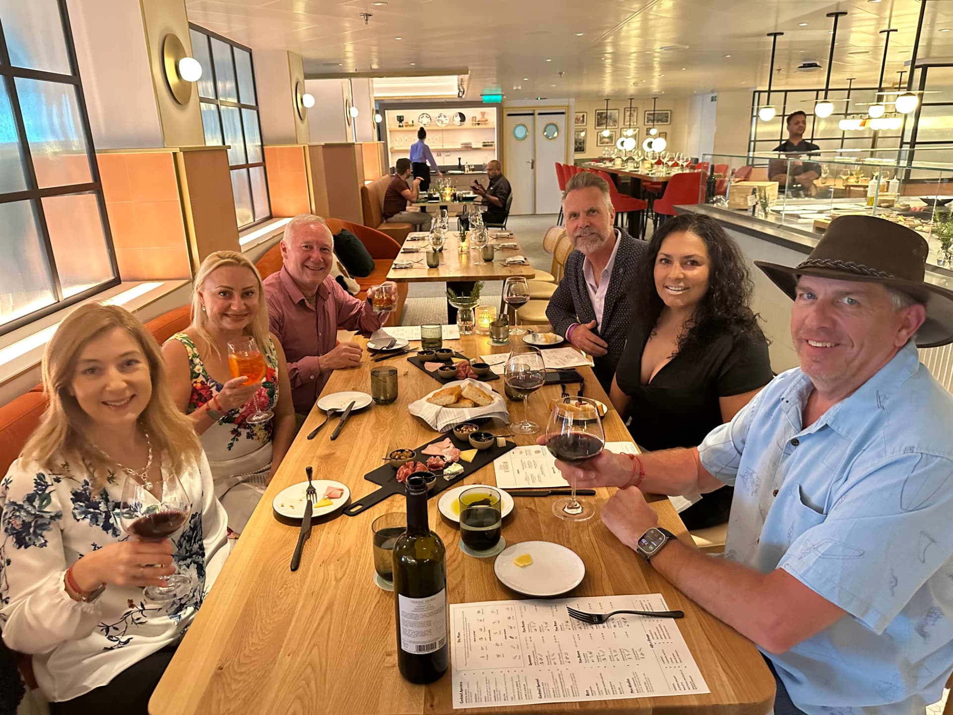 Group dinner at a specialty restaurant on board a cruise ship