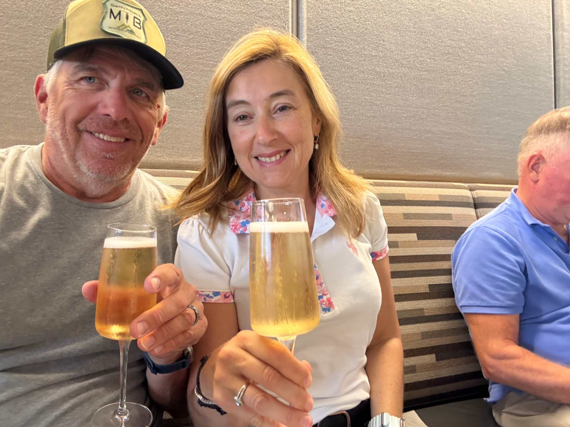 Natalia toasting with a glass of sparkling wine at the start of a trip