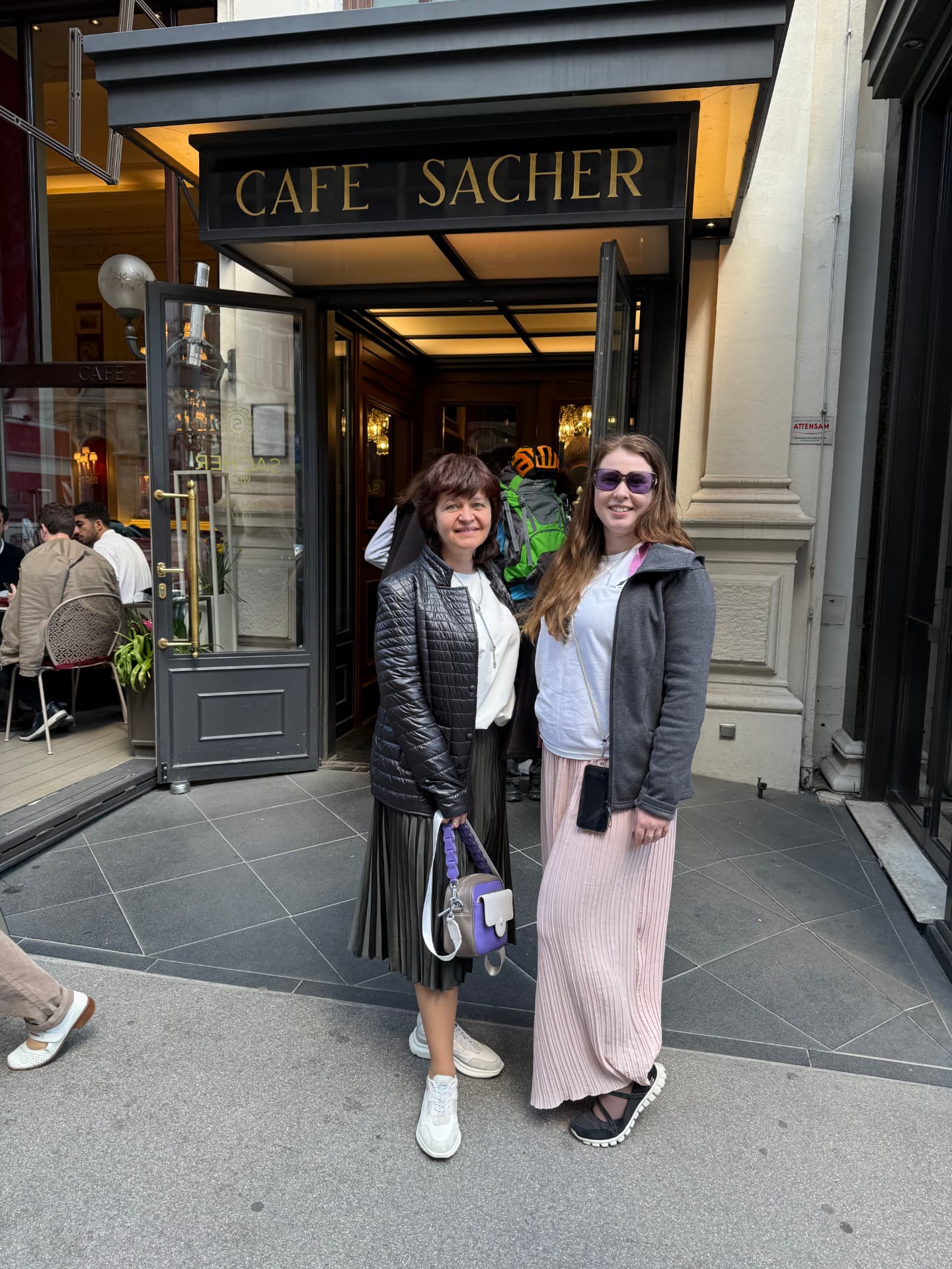 Outside the entrance of Cafe Sacher in Vienna